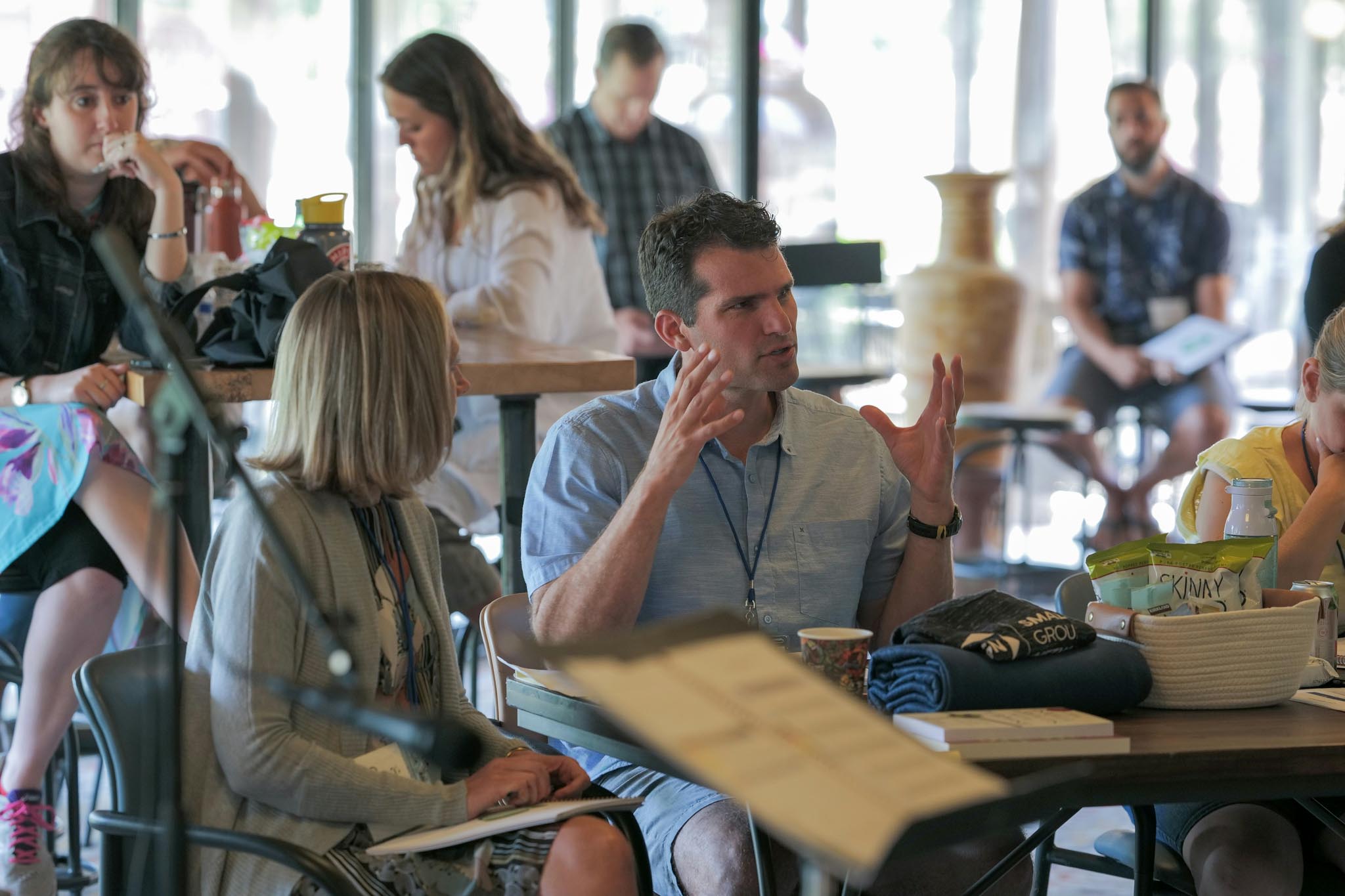 Church leaders planning ministry follow-up around a table
